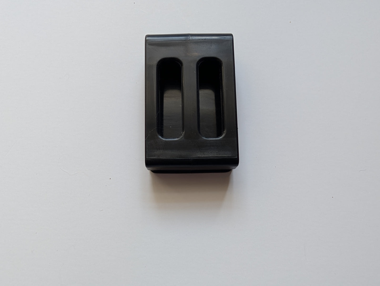 Close up of the plastic Cowbelt clip that holds the strap