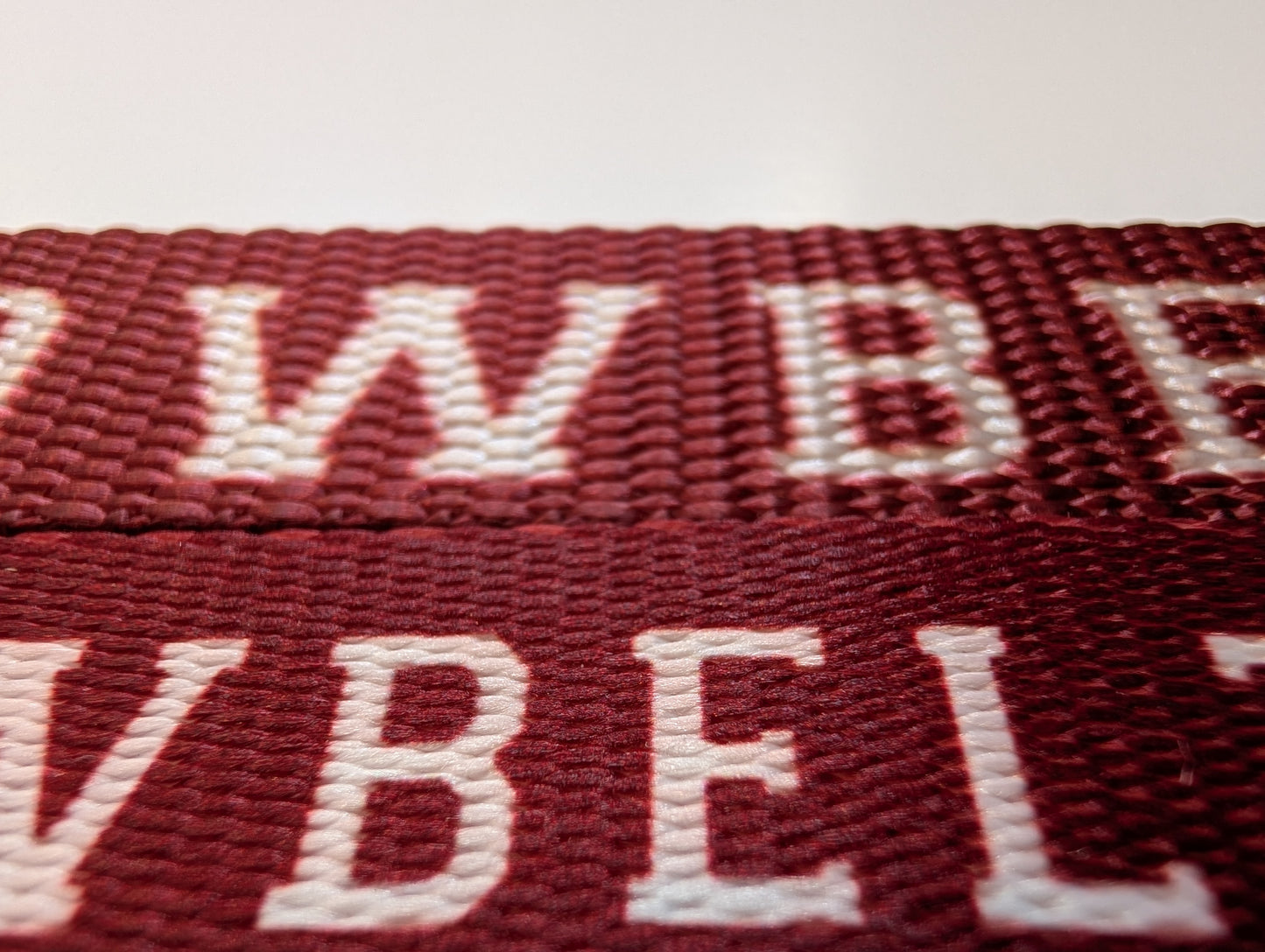 Close-up of the old and new Cowbelt strap variations