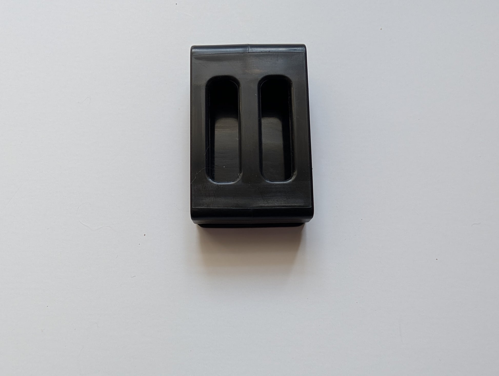Close up of the plastic Cowbelt clip that holds the strap